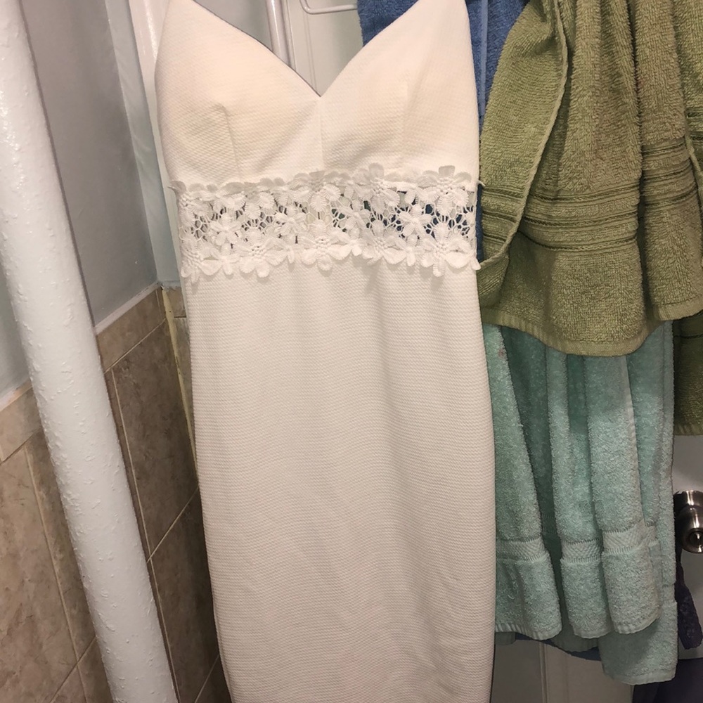 White dress with a see through floral pattern